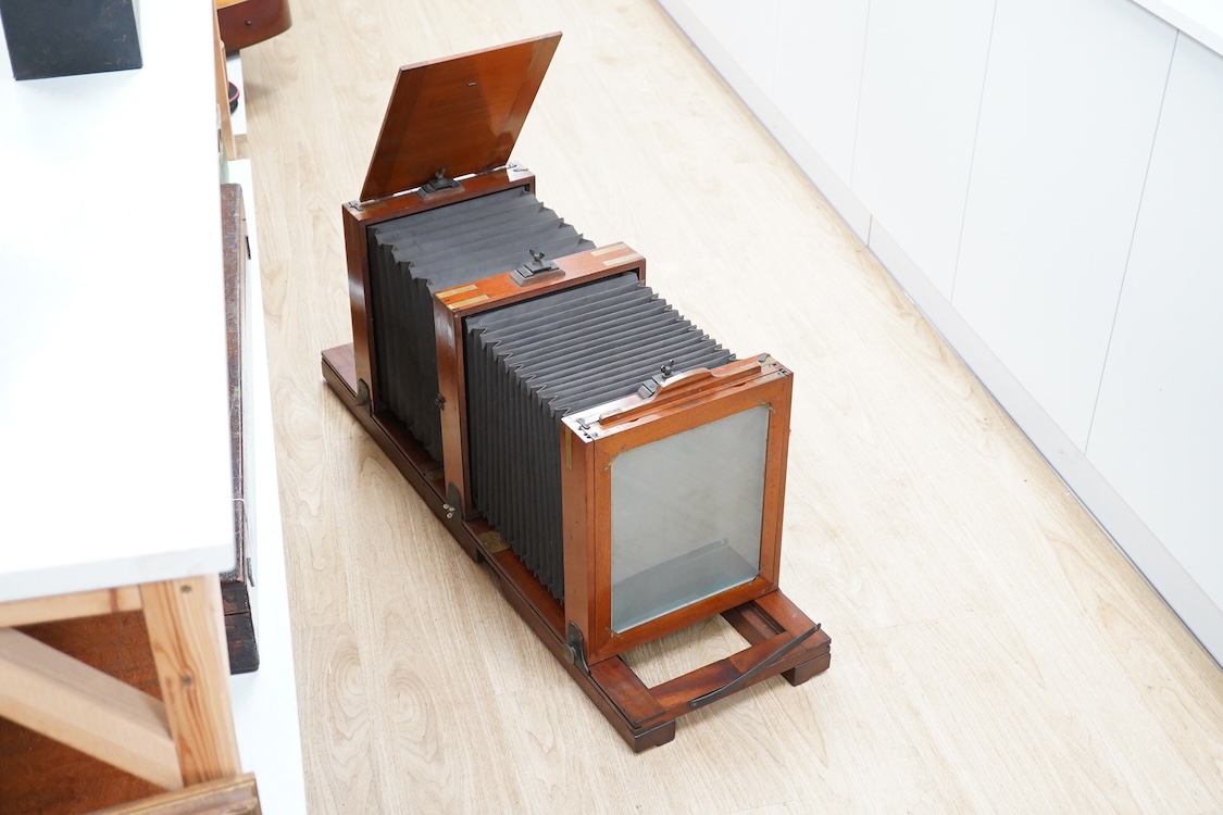 A late 19th/early 20th century pinhole type large full plate mahogany studio camera, unsigned, 51cm high, 34cm wide, 33cm deep